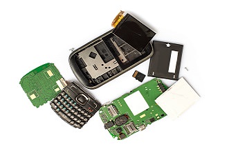 Disassembled mobile phone parts on white background